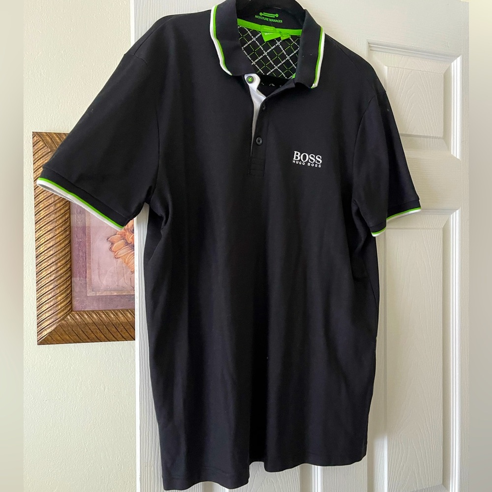 Hugo Boss polo shirt. Black with white and green accents on collar.